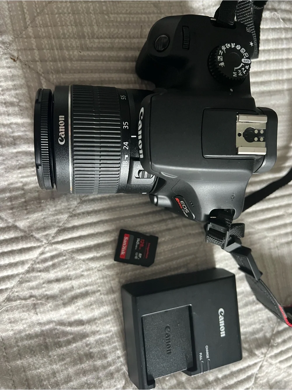 Canon Black DSLR with 18-55mm Lens and Red-Trim Strap